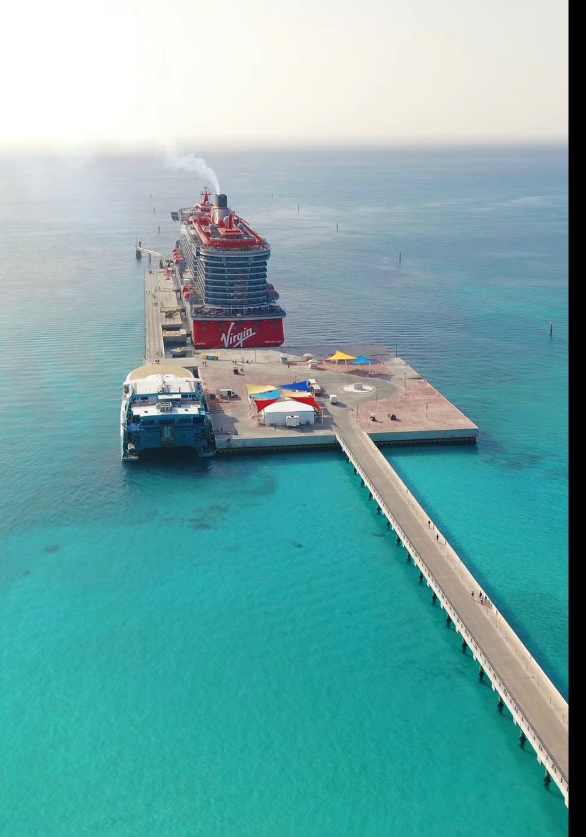 Cruise ship docked at the Bimini pier in turquoise water